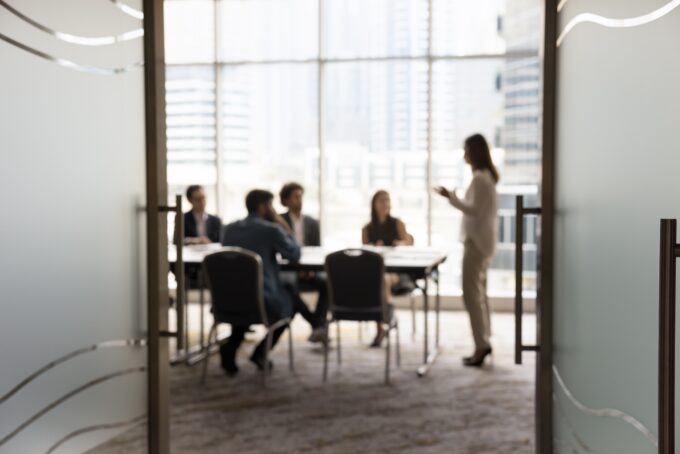 Company directors discussing their duty to act in good faith during a board meeting